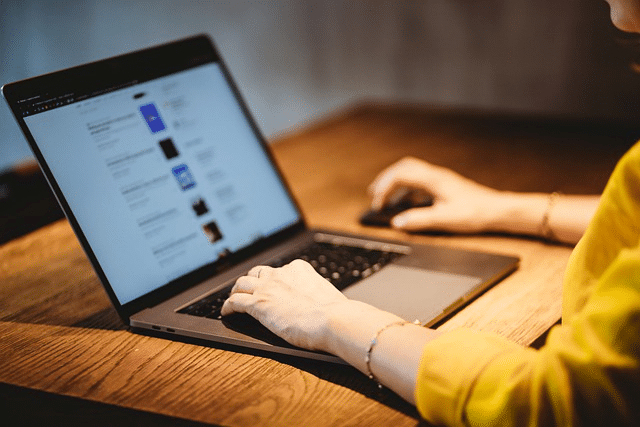 someone on a laptop on the web