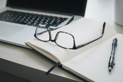 glasses on notepad