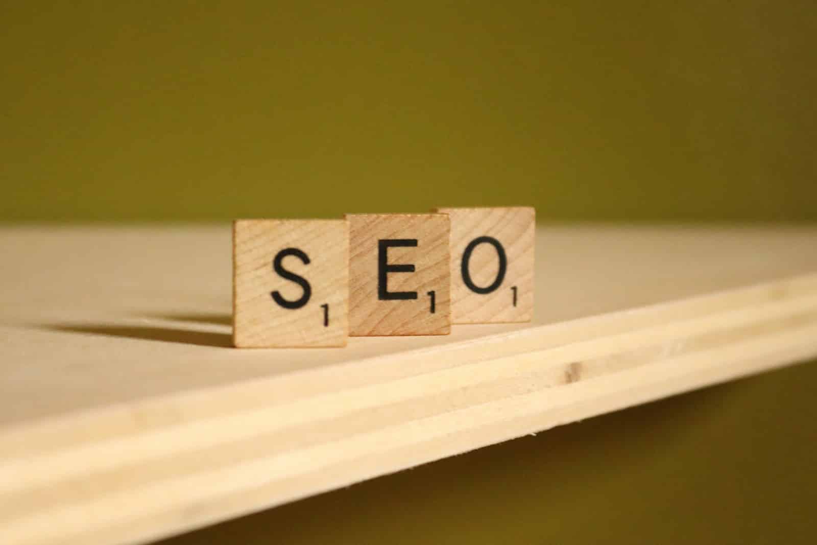 a wooden block that says seo on it small business seo services