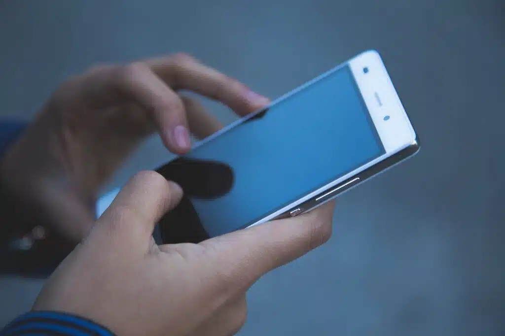 Designing for the Thumbs Up! Mastering Mobile Website Design for Small Businesses 4 hands, phone, smartphone
