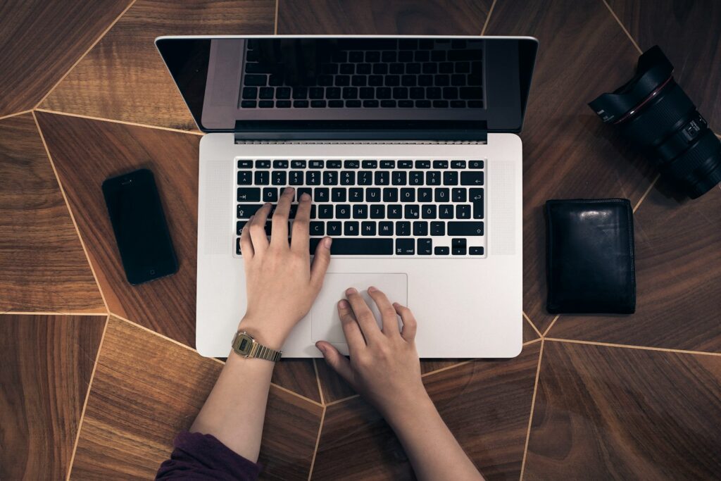 The Ultimate Guide on How to Check Website Ranking Effectively 3 person using MacBook Pro