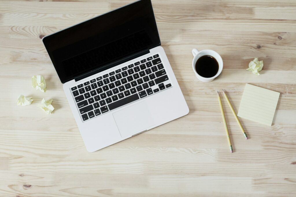 Best Email Hosting for Small Business Success in 2025 5 turned off MacBook Pro beside white ceramic mug filled with coffee