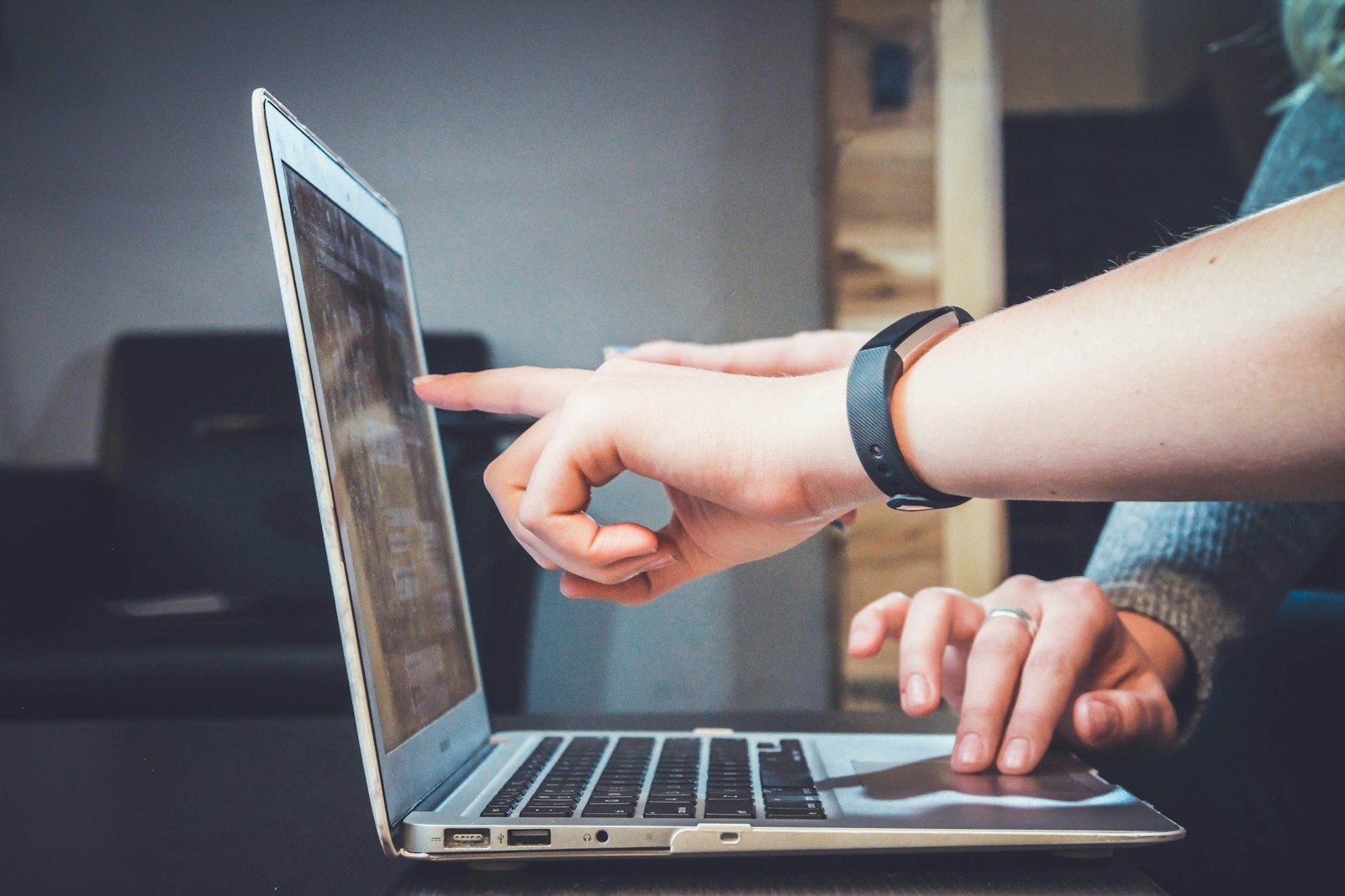 person using laptop affordable seo services for small businesses