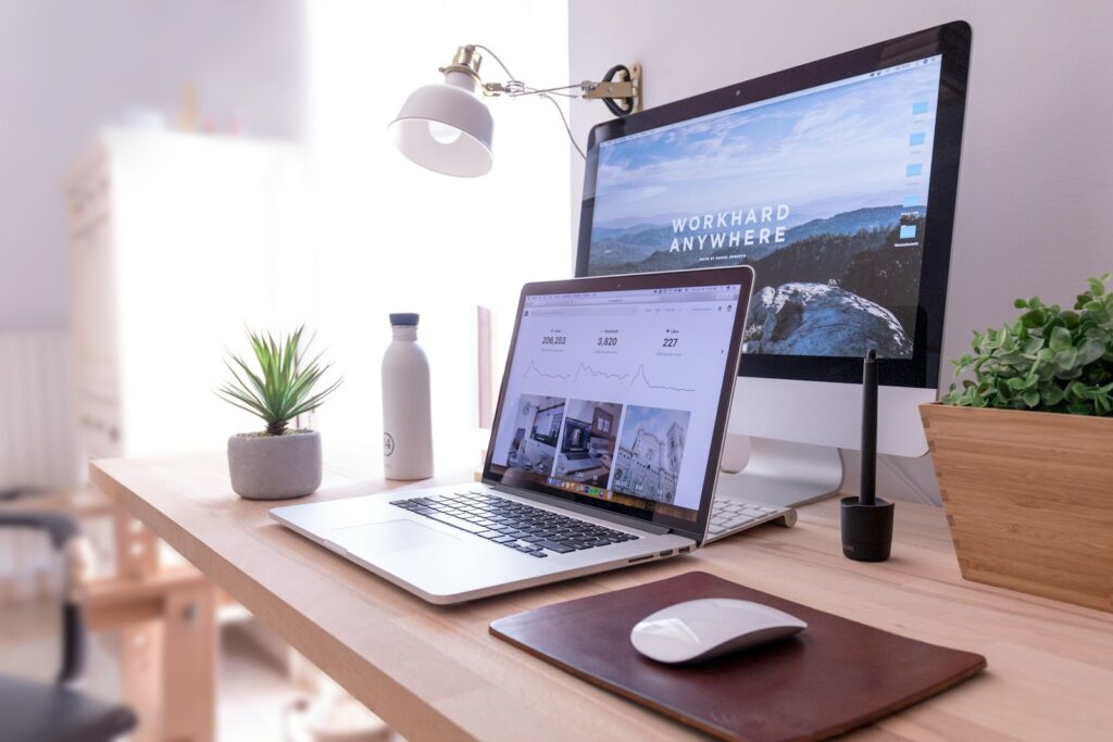 43 Creative Website Ideas to Inspire Your Next Project in 2025 3 MacBook Pro on table beside white iMac and Magic Mouse