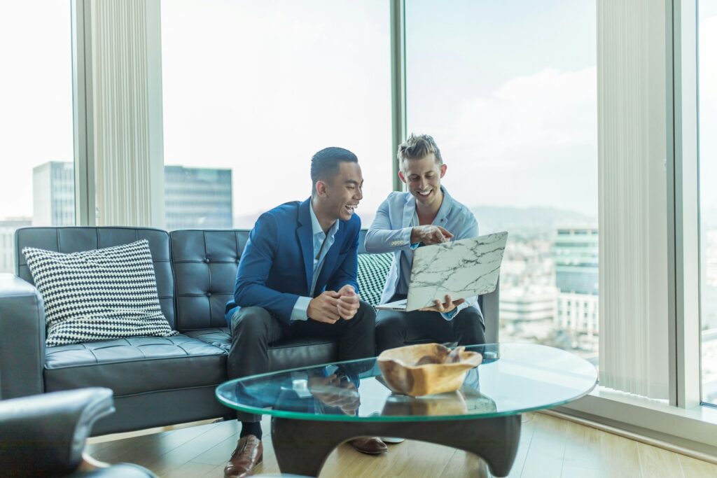 Small Business Bookkeeping Made Simple 2 two men in suit sitting on sofa