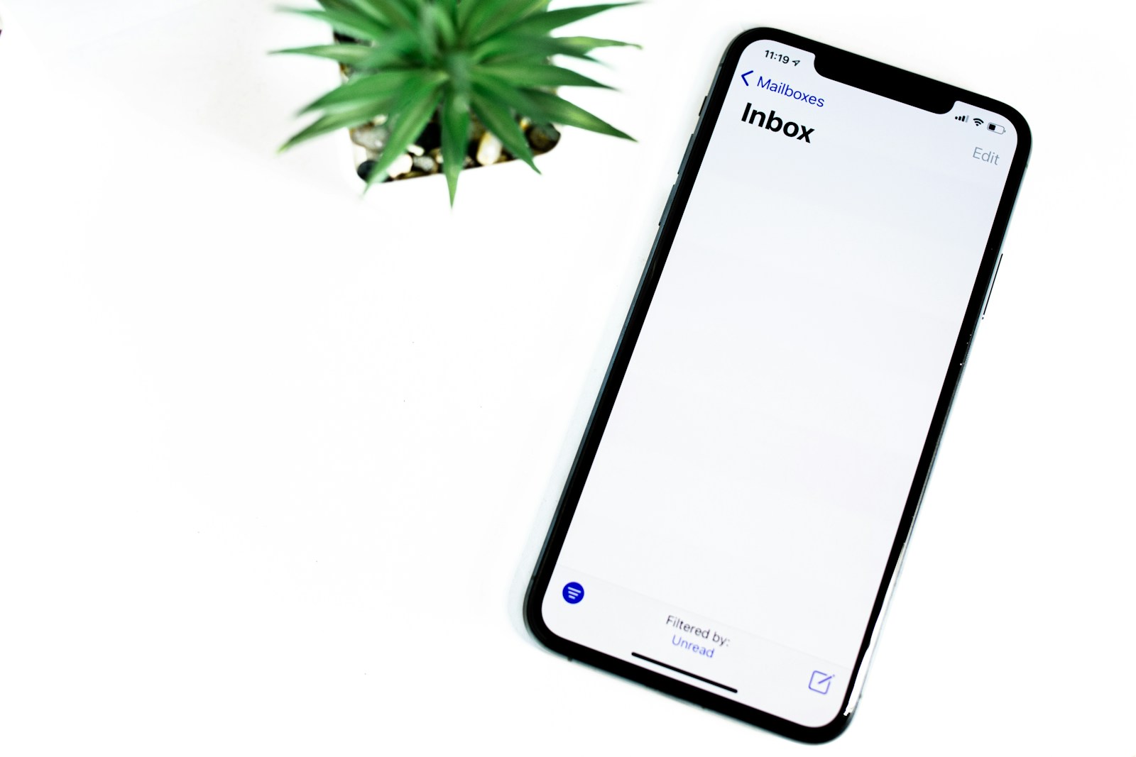 black iphone 5 on white surface best email hosting for small business