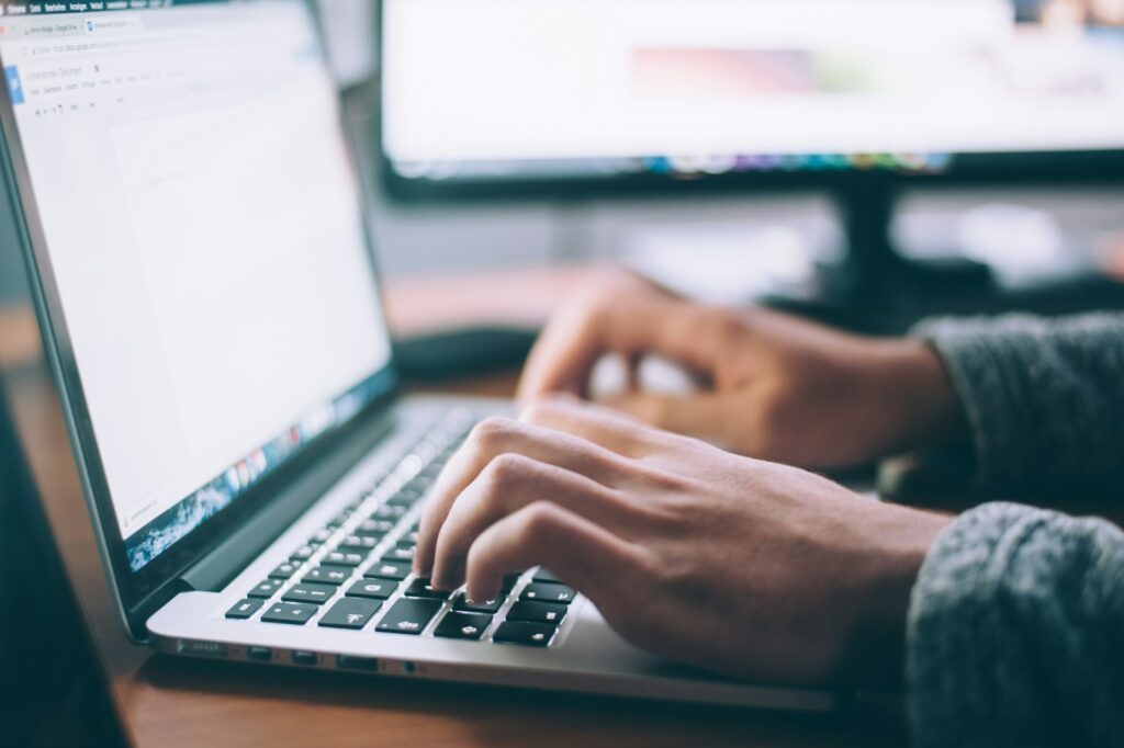 The Ultimate Guide on How to Check Website Ranking Effectively 2 person using MacBook Pro