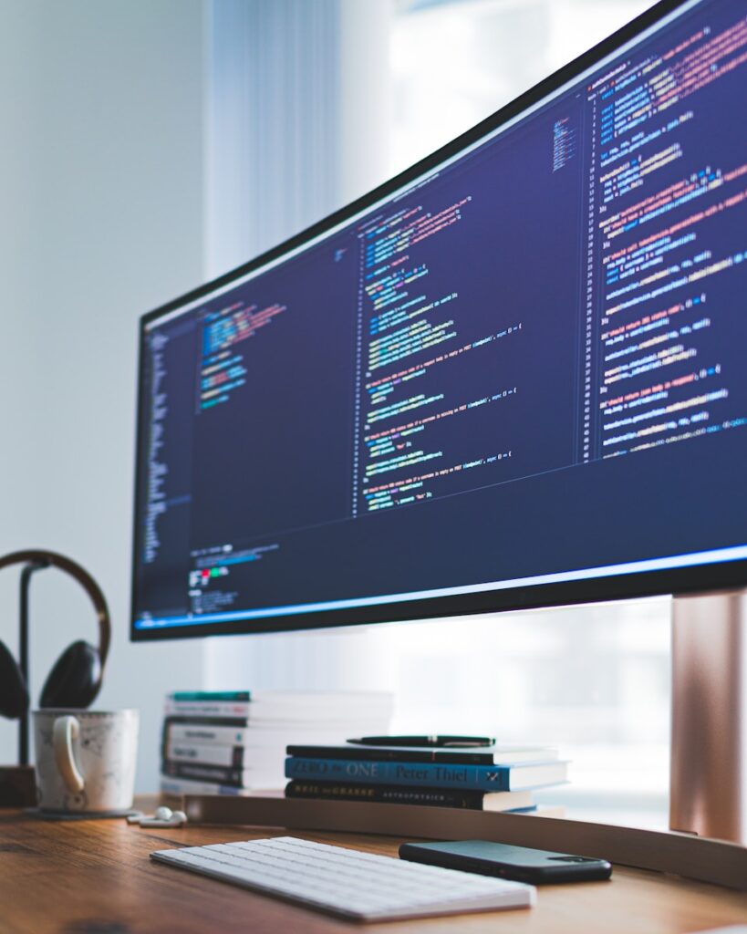How to Code a Website: A Step-by-Step Guide for Beginners 4 a computer monitor sitting on top of a wooden desk