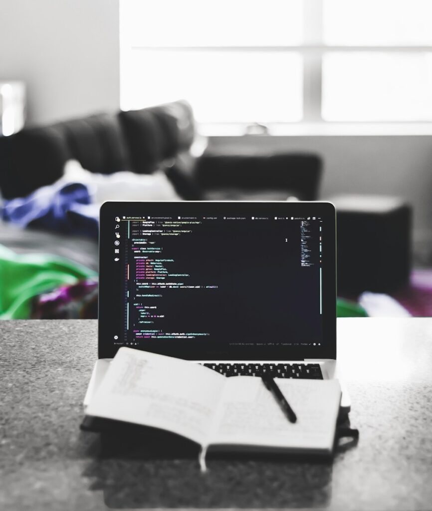 Why Small Businesses Should Outsource Web Development to Priceless Consulting 6 white notebook