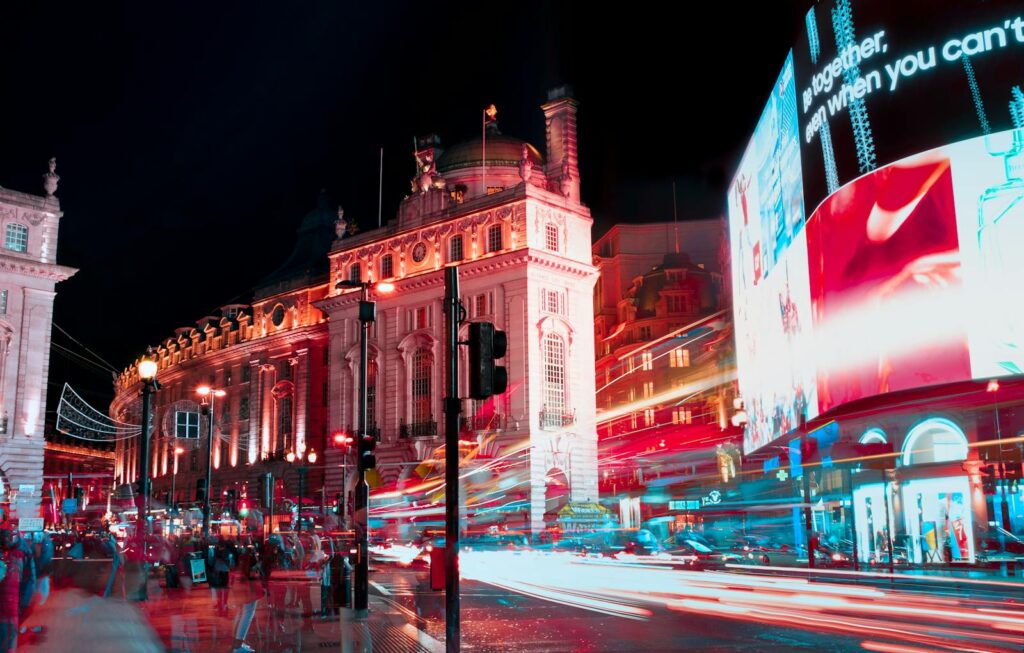 Unlocking the Potential of Paid Media Services with Priceless Consulting 13 Long exposure captures vibrant city lights and nightlife at Piccadilly Circus, London.