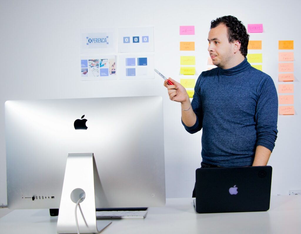 Digital Marketing Experts: Unlocking Your Business's Potential 2 man in blue crew neck t-shirt holding black laptop computer