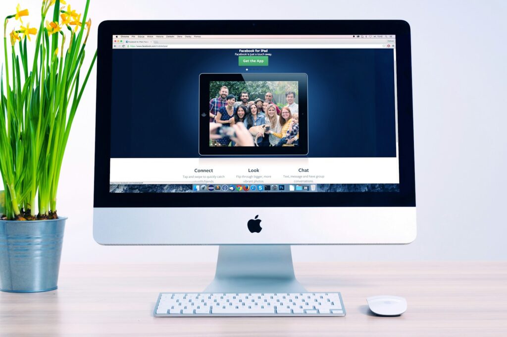 Web Design Services for Small Business Success with Priceless Consulting 7 turned on silver iMac