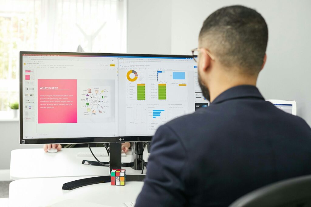 Search Engine Marketing Consultant: Everything You Need To Know 7 a man sitting at a desk looking at a computer screen