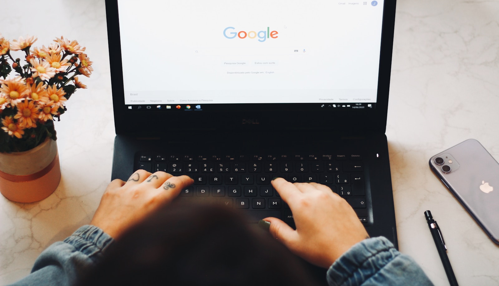 person using black laptop computer how to delete a google review