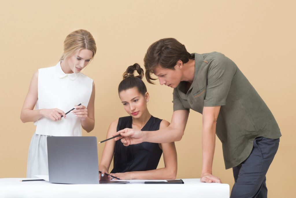 Digital Marketing Experts: Unlocking Your Business's Potential 6 man teaching woman while pointing on gray laptop