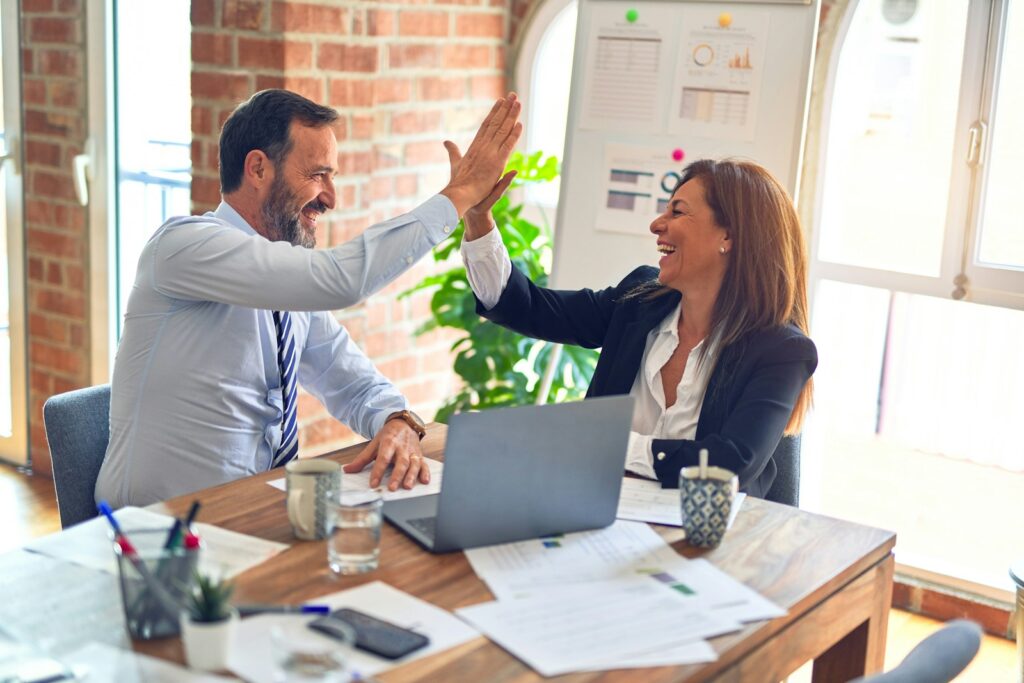 Social Media for Business: Your Complete Guide to Success 2 man in white dress shirt sitting beside woman in black long sleeve shirt