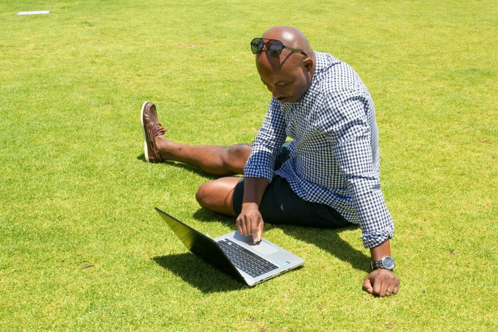 Social Media Consultant: Your Complete Guide to Success 1 man in blue and white checkered button up shirt sitting on green grass field