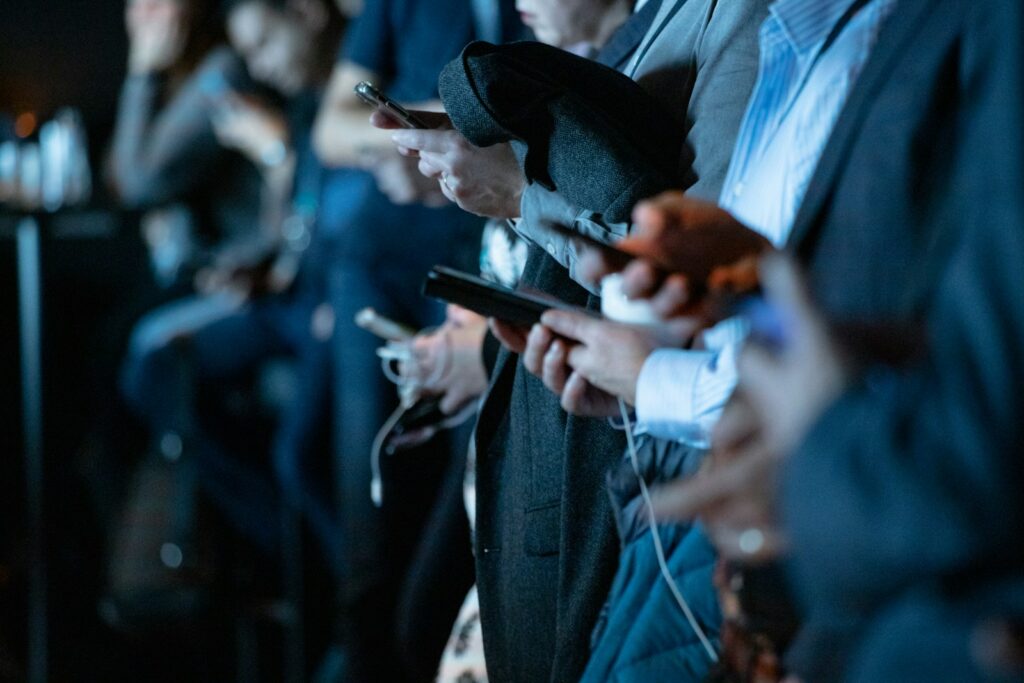 Navigating Social Media Law in 2025 1 people using phone while standing