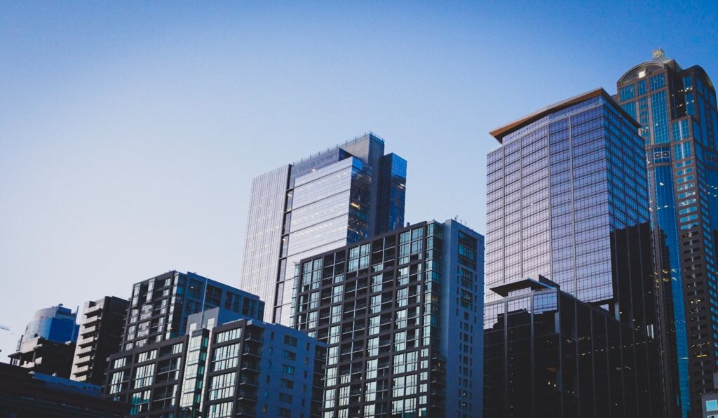 Real Estate Digital Marketing Guide for 2025 2 white and blue glass walled high rise building