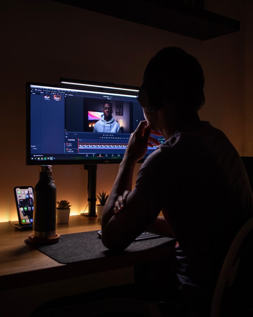 How to Become a Social Media Content Creator in 2025 2 boy in black long sleeve shirt sitting on chair in front of black flat screen tv