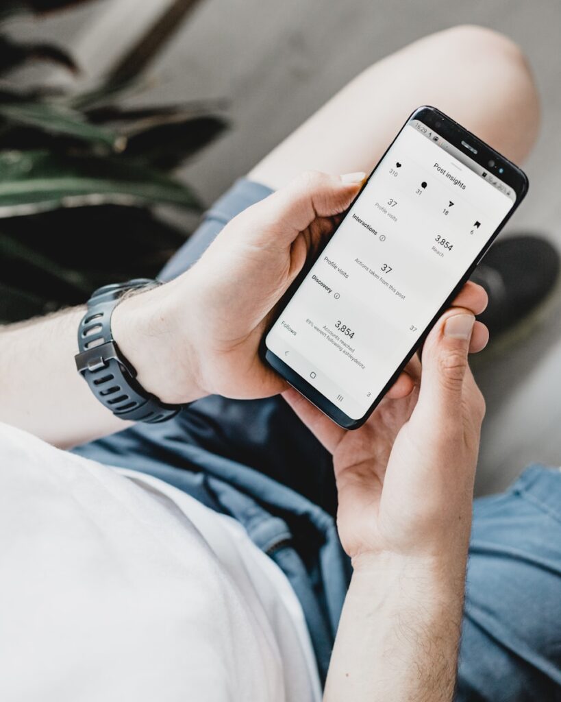 Best Time to Post on Social Media for Maximum Engagement 4 person holding black android smartphone