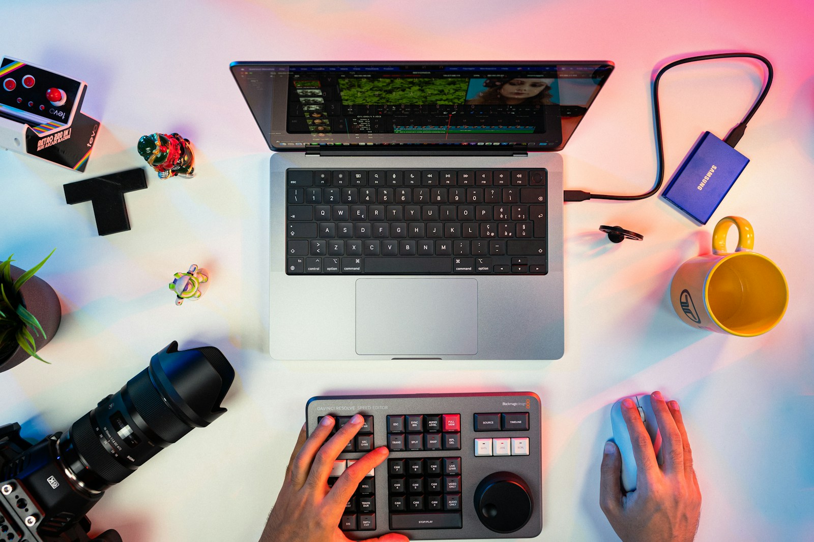 a person typing on a keyboard next to a laptop social media content creator
