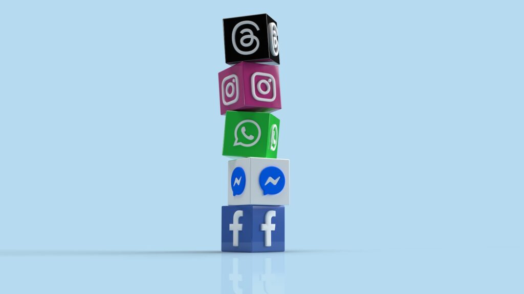 The Complete Social Media Audit Guide for Small Businesses 2 a stack of colorful blocks with social icons on them