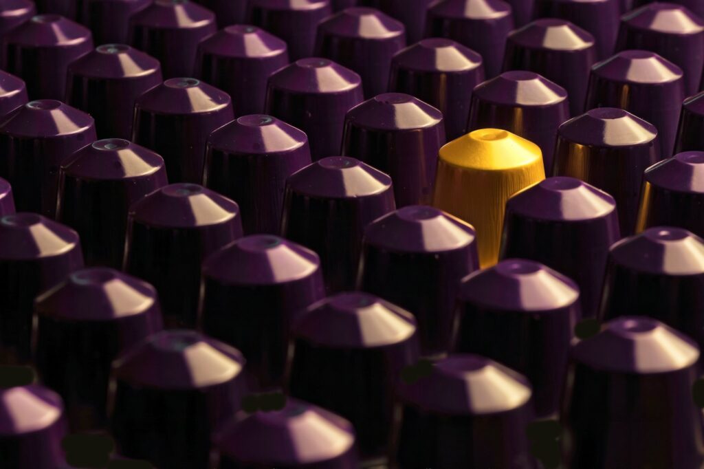 A large group of purple and yellow bullet caps