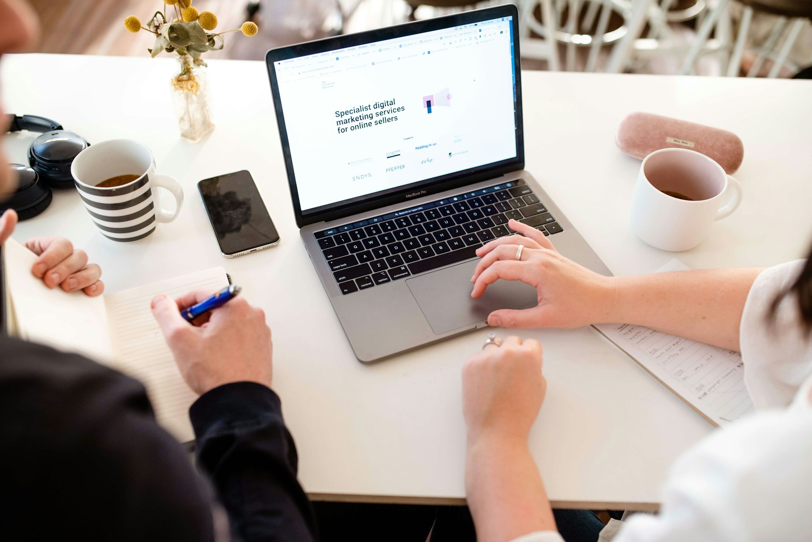 a person working on a laptop (Web Design Agency) | Why Your Business Needs a Top-Tier Partner