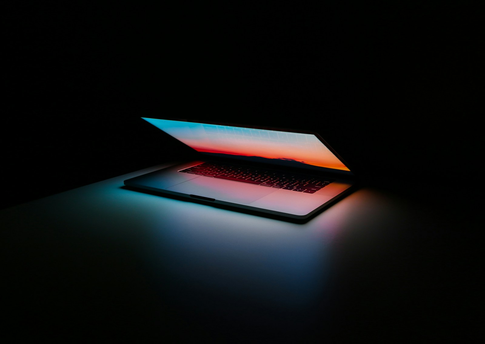 gray and black laptop computer on surface (Website Redesign Services): Giving Your Brand a Fresh, Modern Look